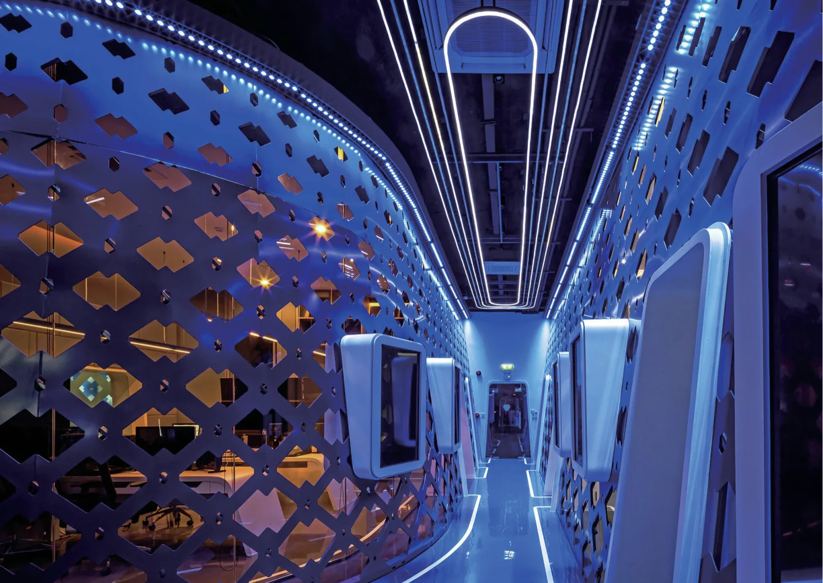 Long corridor with continuous LED strip lighting along the ceiling