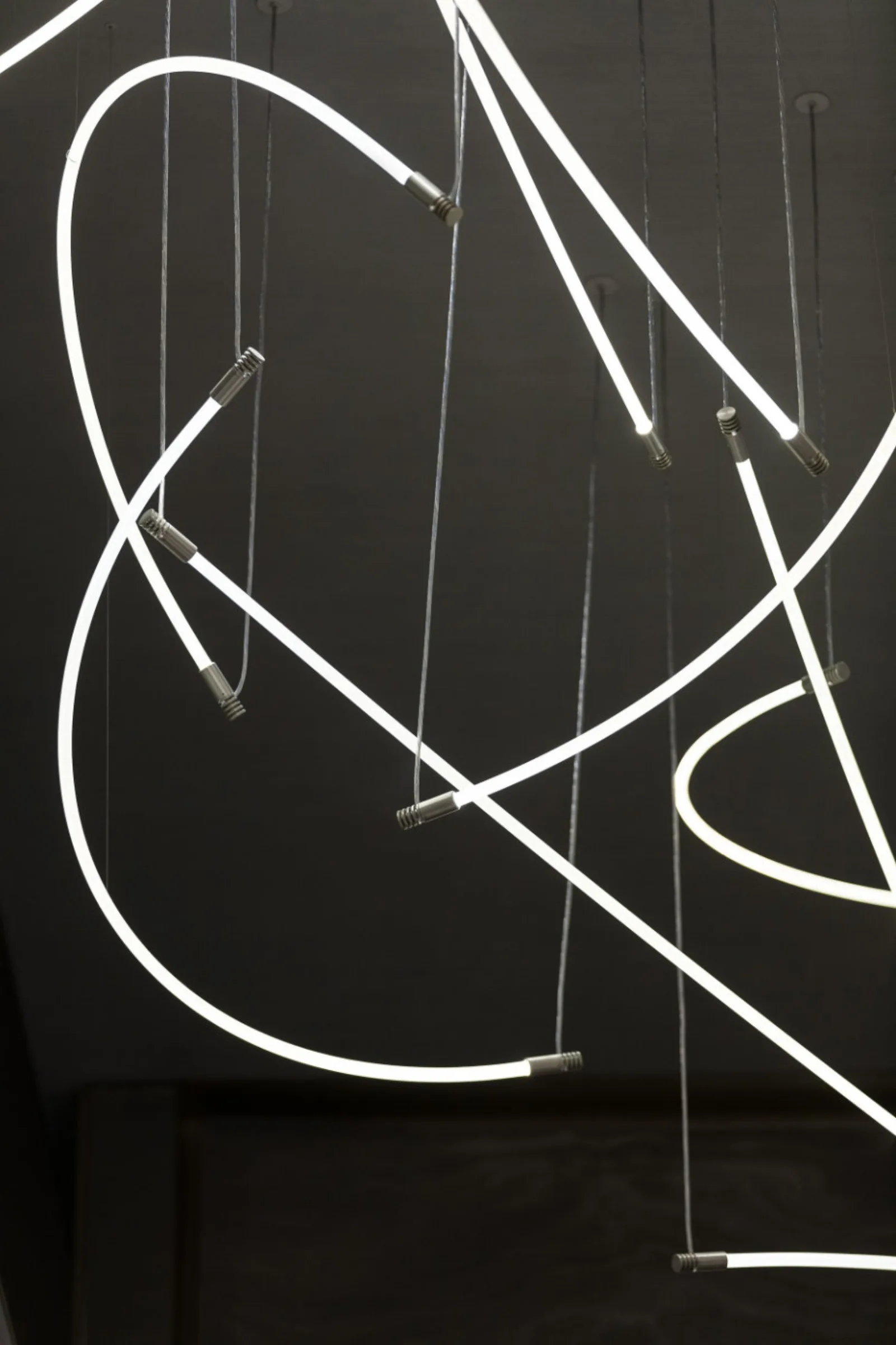 Curved LED neon flex forming a glowing sculptural line